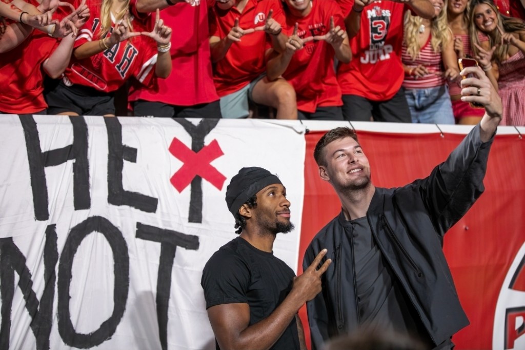 Utah Jazz players, Darryn Peterson and Kyle Filipowski taking a selfie with The Muss