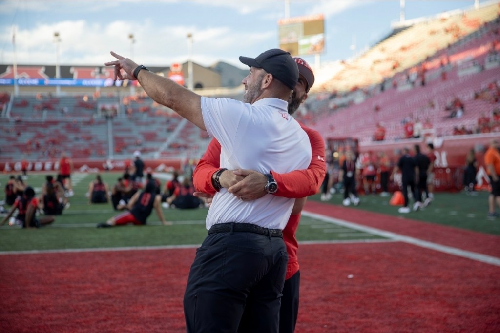 Morgan Scalley interacts with Eric Weddle before the game